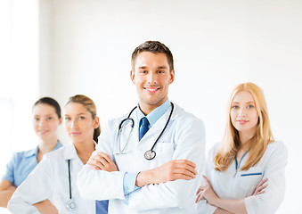 Image showing male doctor in front of medical group