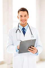 Image showing male doctor writing prescription