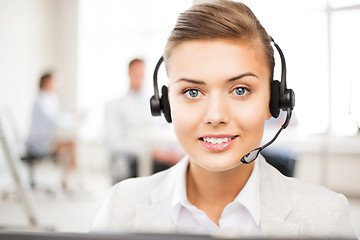 Image showing helpline operator with headphones in call centre