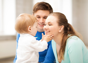 Image showing happy parents playing with adorable baby