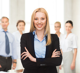 Image showing smiling businesswoman in office