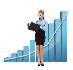 Image showing businesswoman with big 3d chart and folder