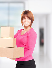 Image showing businesswoman with parcels