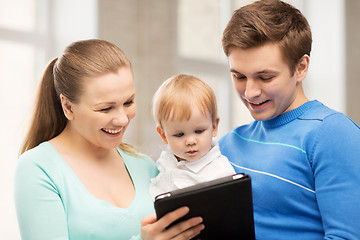 Image showing parents and adorable baby with tablet pc