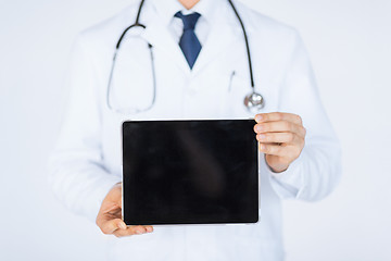 Image showing male doctor holding tablet pc