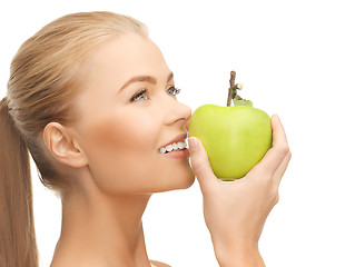 Image showing woman smelling apple