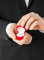 Image showing man with gift box and wedding ring