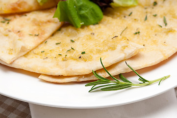 Image showing garlic pita bread pizza with salad on top