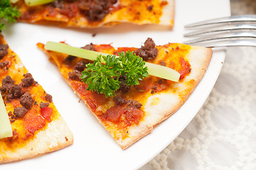 Image showing Turkish beef pizza with cucumber on top