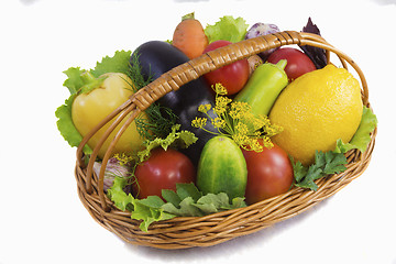 Image showing Basket with fruits and vegetables , photographed on a white back