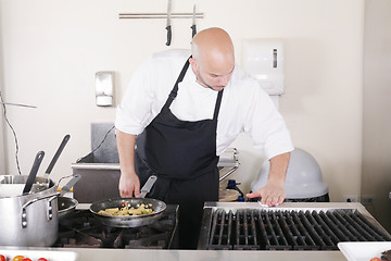 Image showing professional chef cleaning the kitchen 