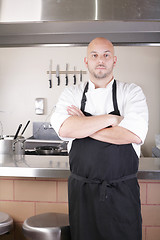 Image showing Male Chef Standing Next To Cooker In Kitchen