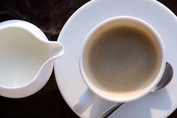 Image showing cup of coffee and milk