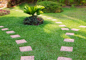 Image showing Stone path on green grass