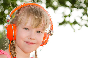 Image showing Closeup portrait of cheerful girl listening lesson