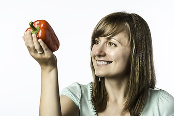 Image showing Young woman looks at papper