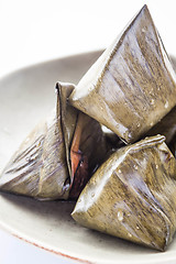 Image showing Close up stuffed dough pyramid dessert