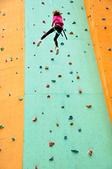 Image showing child climbing down the wall