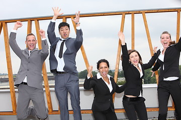 Image showing Successful business team cheering and rejoicing