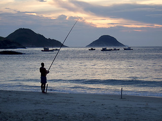 Image showing Fishing on the sunset at the beach in Niterói