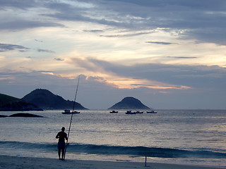 Image showing Fishing on the sunset at the beach