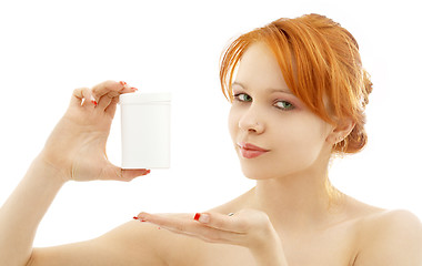 Image showing lovely redhead showing blank medication container