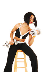 Image showing Girl working dumbbells.