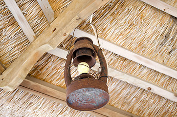 Image showing old rusty lamp  bower straw ceiling electric bulb 