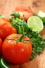 Image showing Tomatoes on a Rustic Wood Plank