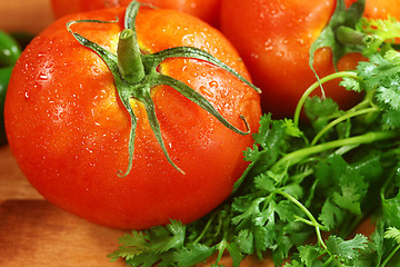 Image showing Tomatoes on a Rustic Wood Plank