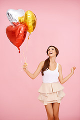 Image showing Cute brunette with balloons