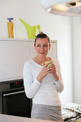 Image showing Attractive woman enjoying a hot drink