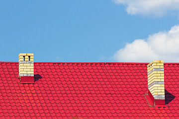 Image showing Red roof with chimneys
