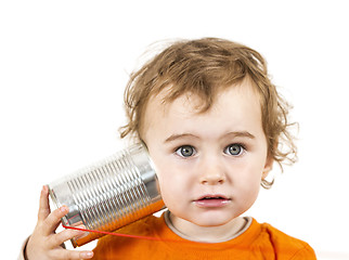 Image showing child with tin can phone looking to camera