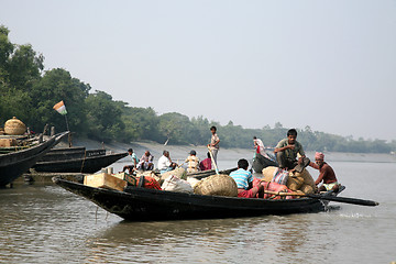 Image showing Wooden boat crosses the Ganges River in Gosaba, West Bengal, India