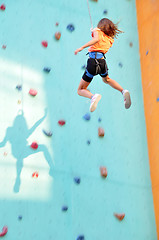 Image showing child sliding down the climbing wall