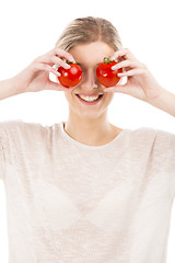 Image showing Beaitiful woman with tomatos in front of the face