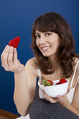 Image showing Eating strawberries