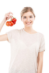 Image showing Beaitiful woman holding red tomatos