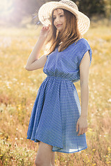 Image showing Beautiful girl on a blue dress