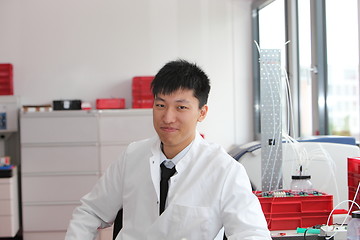 Image showing Asian technician working in a laboratory