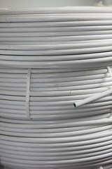 Image showing Rolls of electrical cable and conduit