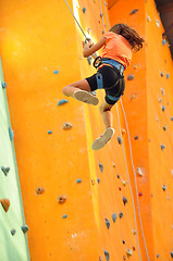 Image showing child sliding down the  climbing wall