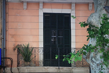 Image showing Wooden door and wrought iron balcony