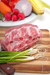 Image showing chopping fresh pork ribs and vegetables