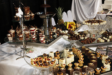 Image showing Colorful desserts and pastry served on a wedding party