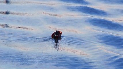 Image showing Small boat - big waves 