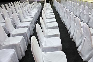 Image showing Rows of white chairs