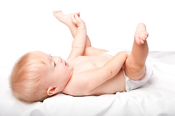 Image showing Cute infant laying on back