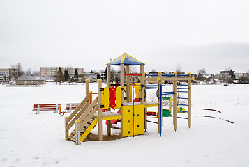 Image showing colorful playground frozen snowy lake house winter 